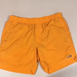 The North Face orange swim shorts. Size large.